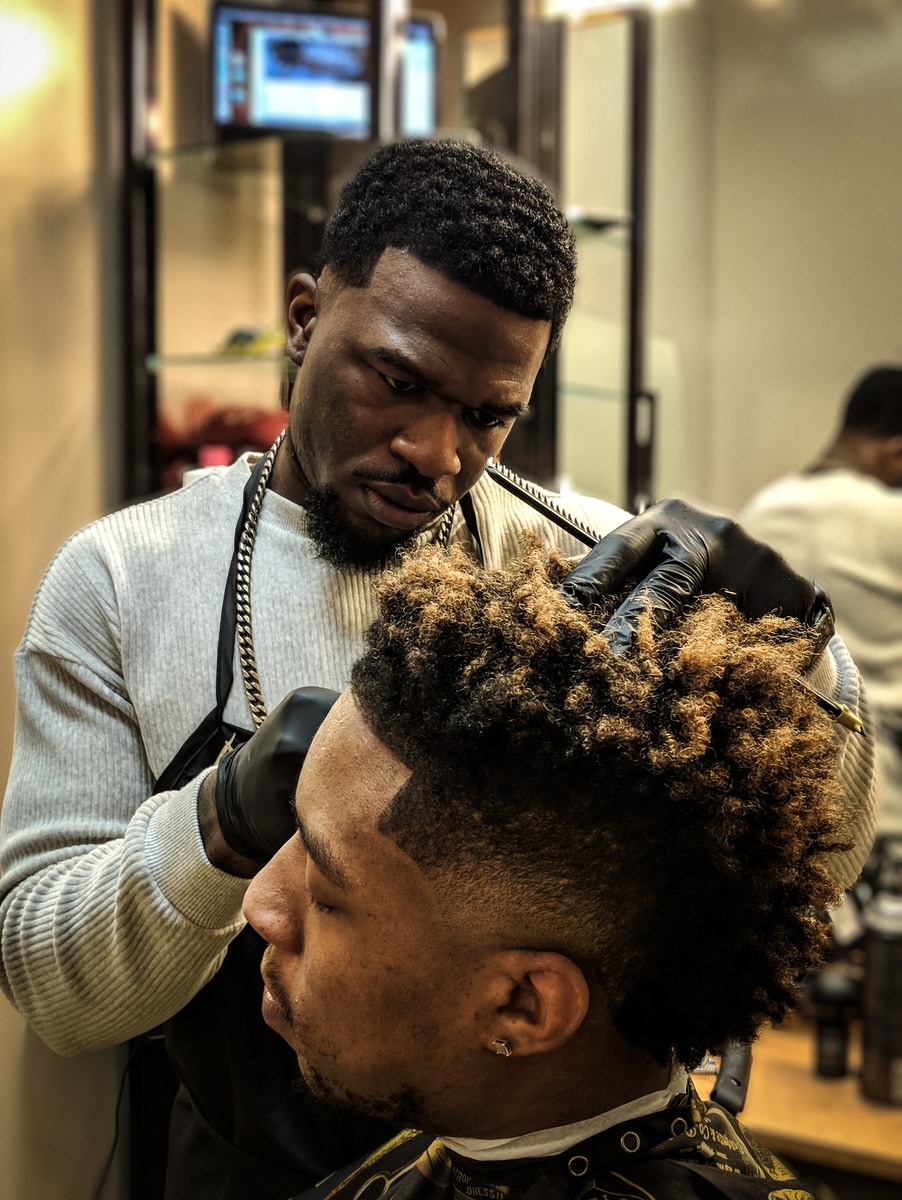 man cutting hair man